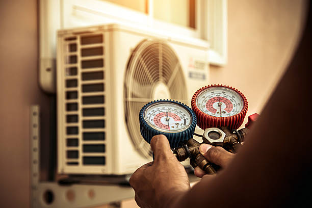 Professional Heat Pump Repair technician working in Mount Olive, IL